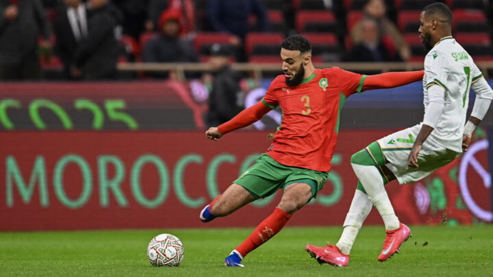 Morocco's forward #20 Ayoub El Kaabi calebrates his goal with Morocco's defender #26 Anass Salah-Eddine during the Africa Cup of Nations (CAN) group A football match between Morocco and Comoros at Prince Moulay Abdellah Stadium in Rabat on December 21, 2025.
