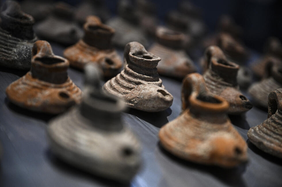 Oil lamps from the Byzantine era on display at the Arab World Institute in Paris.