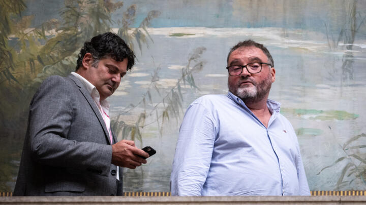 Former French anesthetist Frédéric Péchier alongside his lawyer Randall Schwerdorffer during a break on the first day of his trial at the court in Besançon, northeastern France, on September 8, 2025.