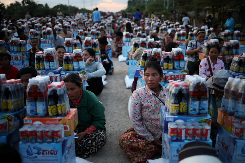 Suang Sreang, 27, who is pregnant and due to give birth within days, evacuated from Seila Khmer, Ou Beichoan Commune, Ou Chrov district, Banteay Meanchey province, waits to receive supplies at Wat Por