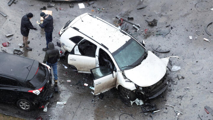 Investigators work near the damaged Kia Sorento at the scene where Lieutenant General Fanil Sarvarov, head of the Russian General Staff's army operational training directorate, was killed in a car bomb in Moscow, Russia, on December 22, 2025.