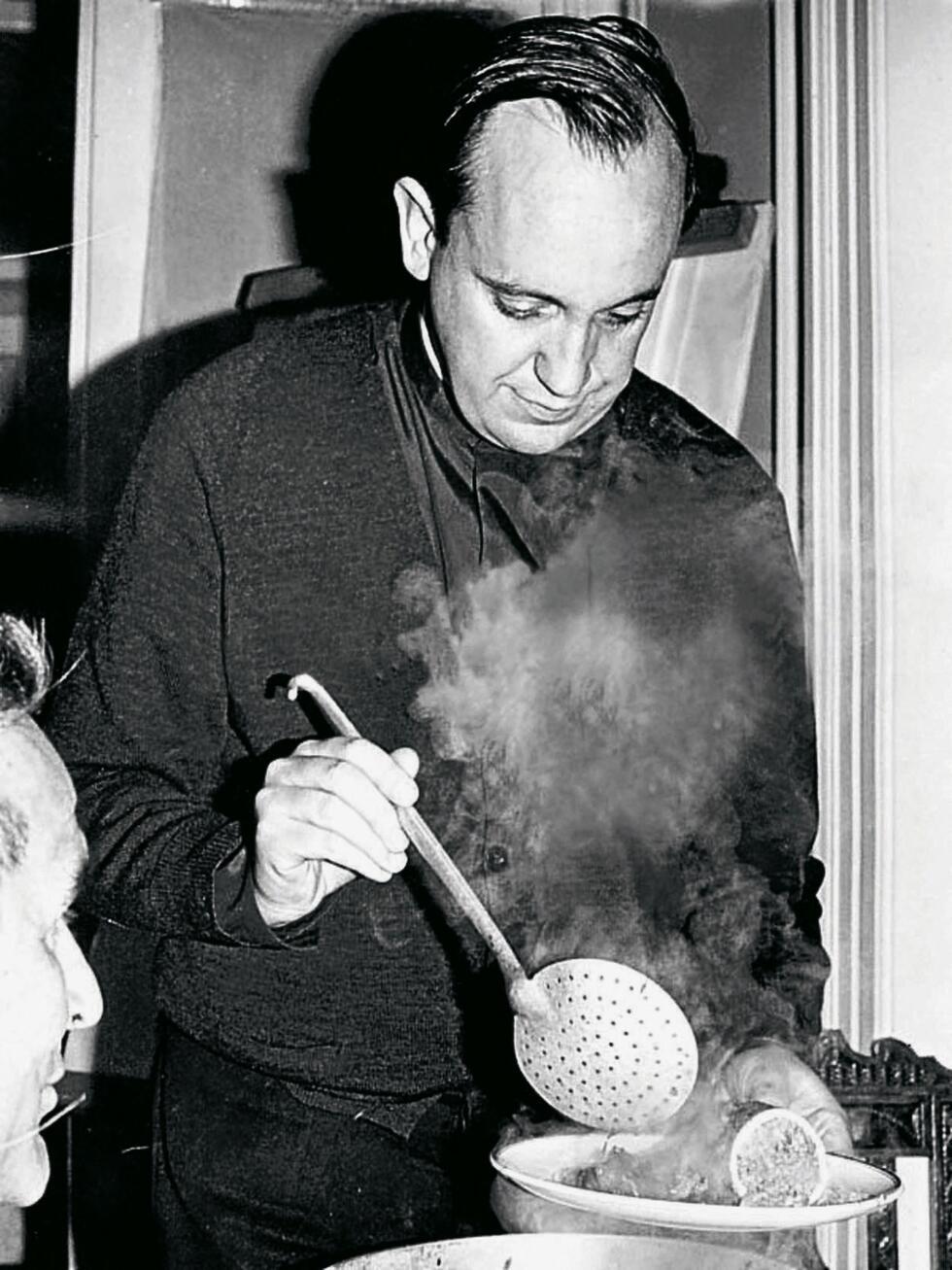 Undated handout picture released by his family of Argentine Jorge Bergoglio, now Pope Francis, serving a meal in Buenos Aires.