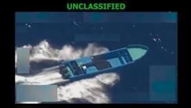 Image from a video released by US Defense Secretary Pete Hegseth appears to show an alleged drug-smuggling boat in the Eastern Pacific Ocean moments before a US military strike 