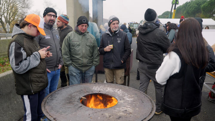 Farmers take part in the blockade of  the A64 motorway to protest the culling of cows due to a skin disease in southwestern France