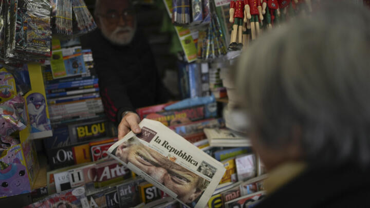A person buys a copy of the Repubblica newspaper in Rome on November 7, 2024.