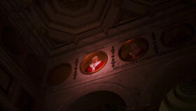  A light illuminates a polychrome mosaic portrait of Pope Francis placed on the frieze of St. Paul's Outside The Walls Basilica in Rome on February 26, 2025. 