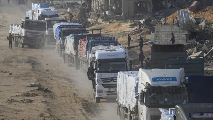 Trucks carrying humanitarian aid enter the Gaza Strip from Egypt in the southern Gaza town of Rafah, on February 12, 2025. 