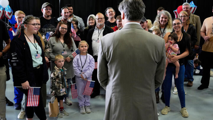 Deputy Secretary of State Christopher Landau welcomes Afrikaner refugees from South Africa on May 12, 2025, at Dulles International Airport in Virginia, US.