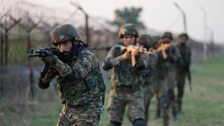 Indian Army soldiers conduct patrol and tactical drills in the Kashmir region between India and Pakistan on October 16, 2025.