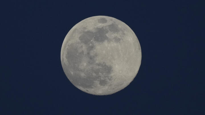 A supermoon is seen in the sky above Yangon, Myanmar on December 4, 2025.