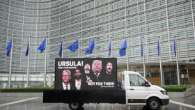 Large billboards calling on EU chief Ursula von der Leyen to stand up to US President Donald Trump.