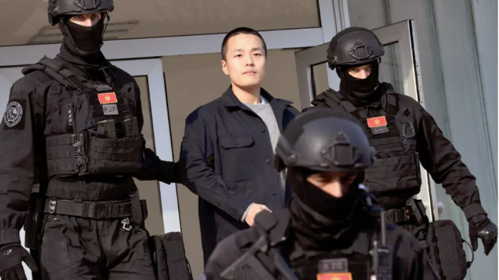 Police officers in Montenegro escort South Korean cryptocurrency mogul Do Kwon as he leaves a courthouse on March 23, 2024.