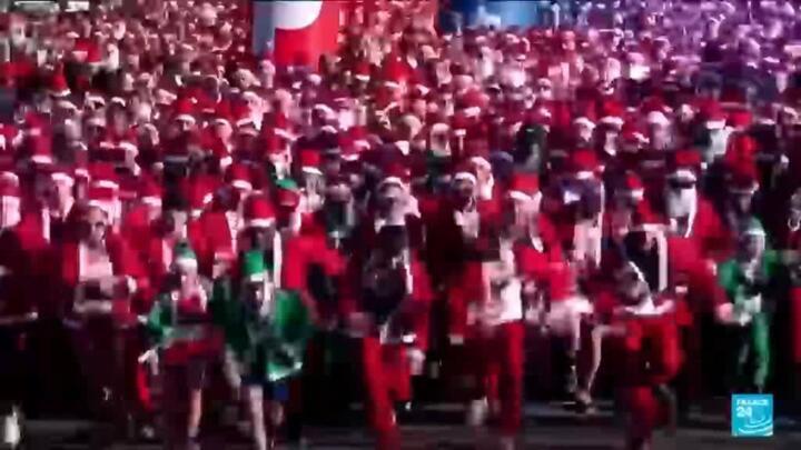 Thousands of runners dressed as Santa take part in a race in Barcelona