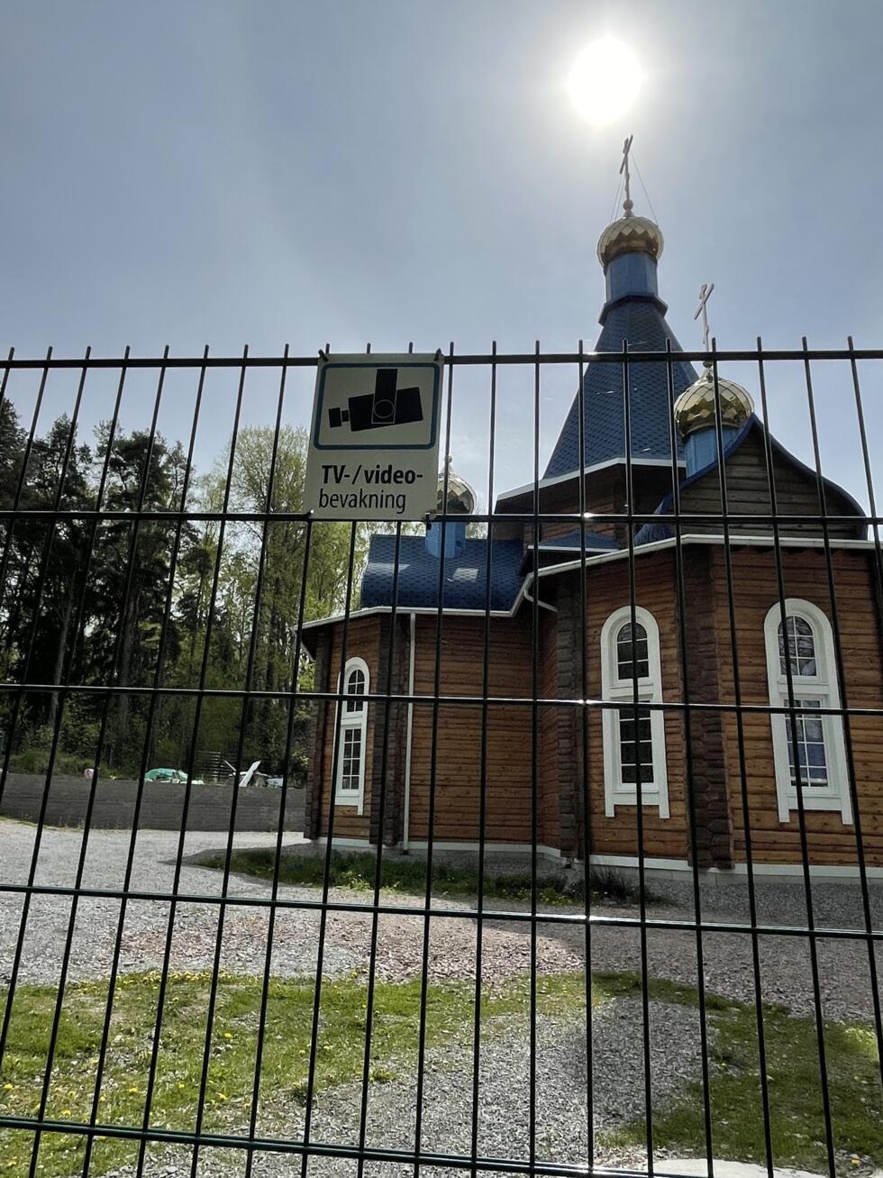 The church is surrounded by a locked gate and several CCTV cameras.