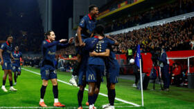 RC Lens players celebrate Odsonne Édouard's opening goal during the Ligue 1 match between Lens and Nice on 14 December 2025 in Lens.