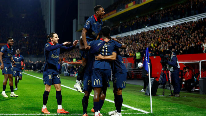 RC Lens players celebrate Odsonne Édouard's opening goal during the Ligue 1 match between Lens and Nice on 14 December 2025 in Lens.